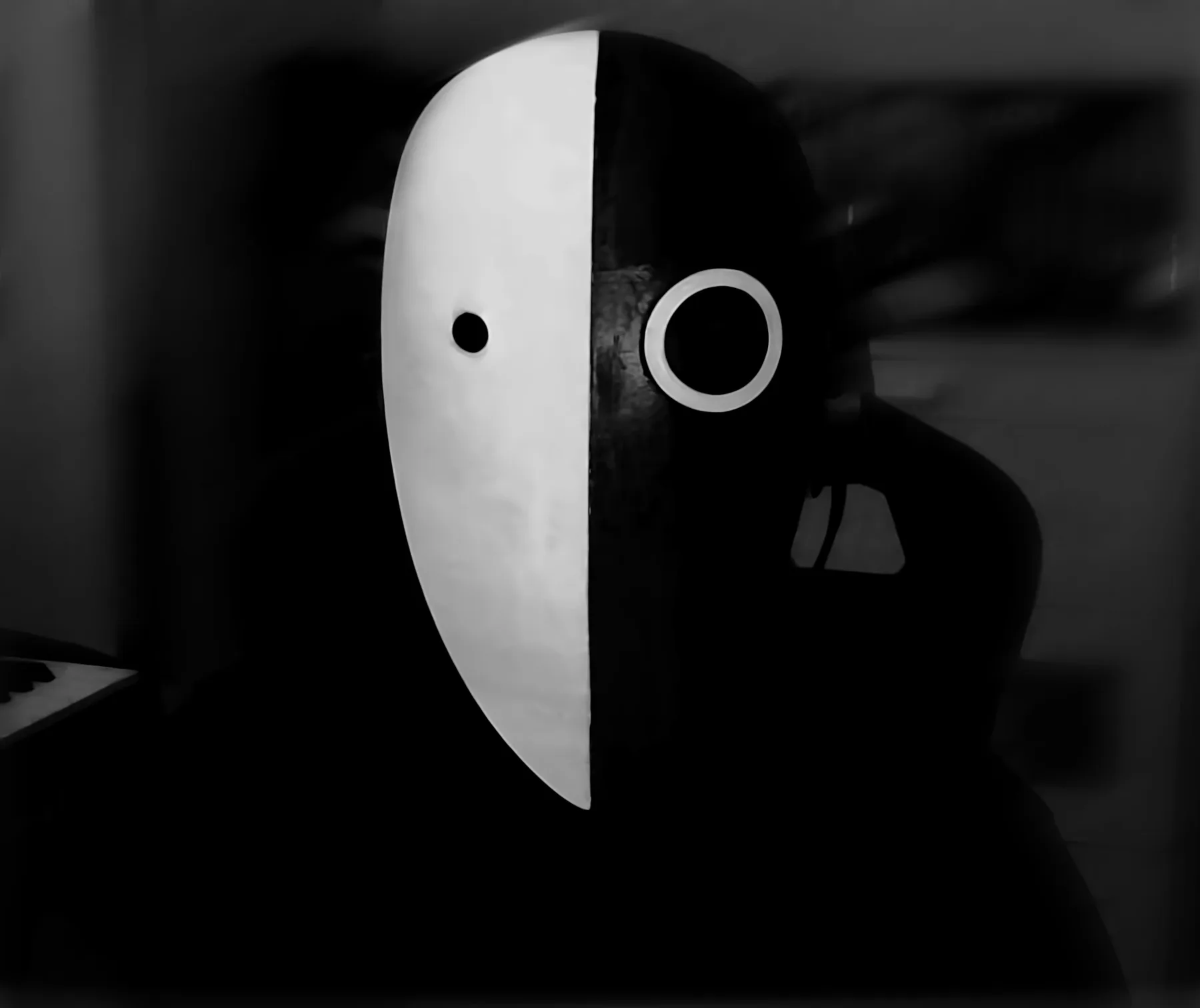 IMP Dariush wearing the split black-and-white mask
