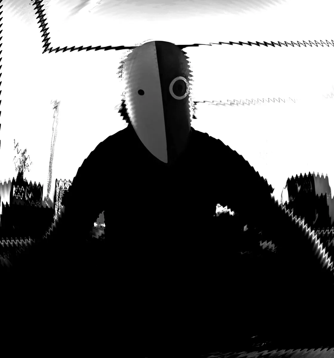 IMP Dariush as a silhouette in the mask against a white wall